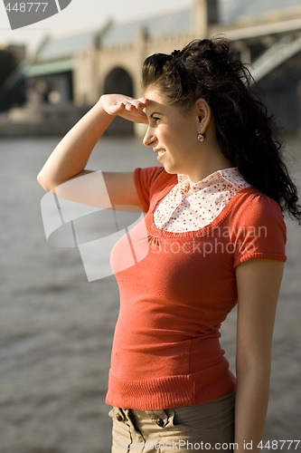 Image of woman looking at river water