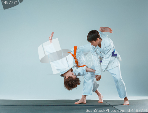 Image of The two boys fighting at Aikido training in martial arts school. Healthy lifestyle and sports concept