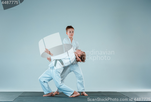 Image of The two boys fighting at Aikido training in martial arts school. Healthy lifestyle and sports concept