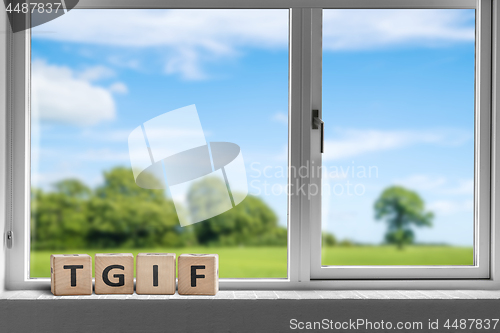 Image of TGIF weekend sign in a white window