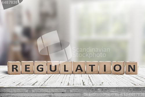 Image of Regulation sign on a wooden table