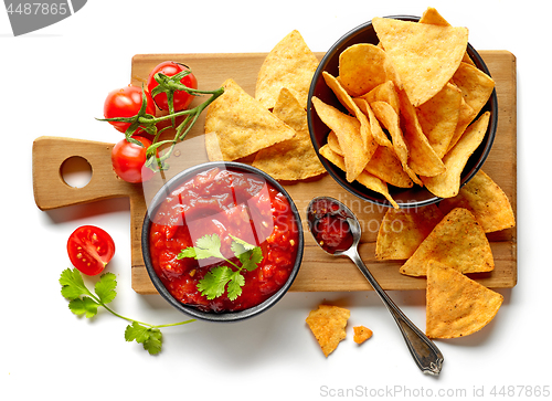 Image of corn chips nachos and salsa sauce