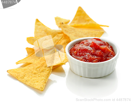 Image of corn chips nachos and salsa sauce