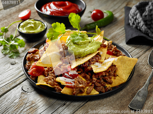 Image of corn chips nachos with fried minced meat