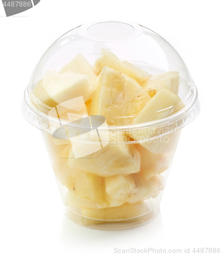 Image of fresh pineapple pieces salad in plastic cup