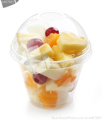 Image of fresh fruit pieces salad in plastic cup