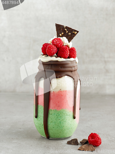 Image of dessert of frozen banana with matcha and raspberries