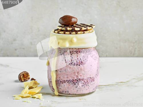 Image of chia pudding with frozen banana and blackberries
