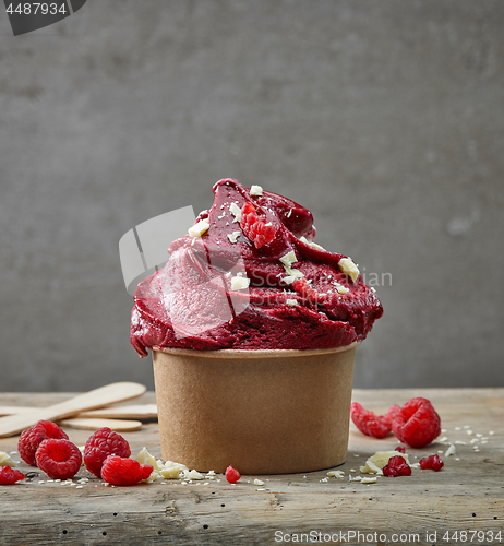 Image of raspberry sorbet decorated with white chocolate pieces