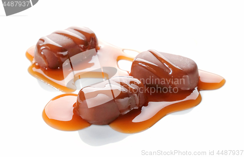 Image of chocolate candies with caramel sauce