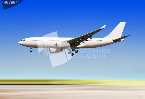 Image of plane landing over runway of airport