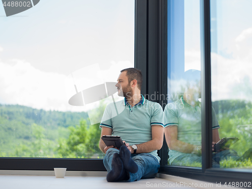 Image of man on the floor enjoying relaxing lifestyle