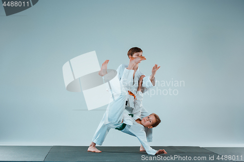 Image of The two boys fighting at Aikido training in martial arts school. Healthy lifestyle and sports concept