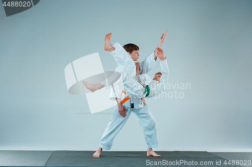 Image of The two boys fighting at Aikido training in martial arts school. Healthy lifestyle and sports concept