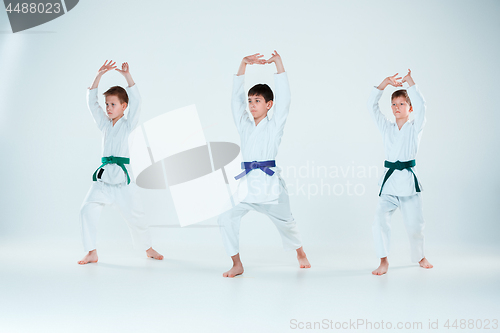 Image of The group of boys fighting at Aikido training in martial arts school. Healthy lifestyle and sports concept