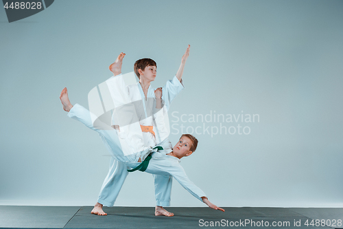 Image of The two boys fighting at Aikido training in martial arts school. Healthy lifestyle and sports concept