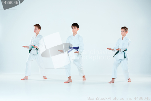 Image of The group of boys fighting at Aikido training in martial arts school. Healthy lifestyle and sports concept