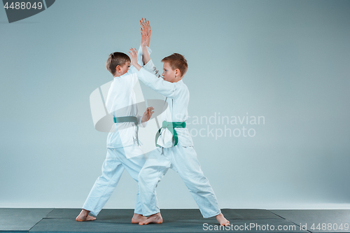 Image of The two boys fighting at Aikido training in martial arts school. Healthy lifestyle and sports concept