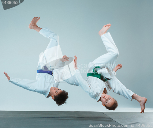 Image of The two boys fighting at Aikido training in martial arts school. Healthy lifestyle and sports concept