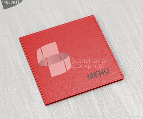 Image of Red menu on wood table
