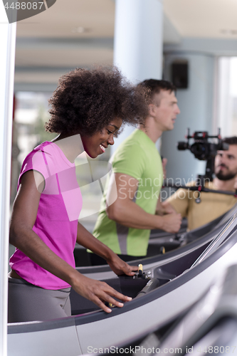 Image of people exercisinng a cardio on treadmill in gym