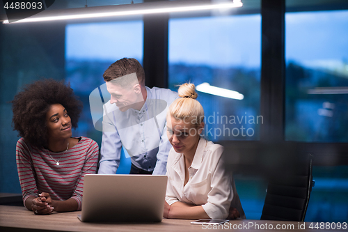 Image of Multiethnic startup business team in night office