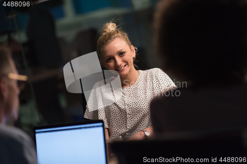 Image of Multiethnic startup business team in night office