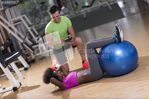 Image of pilates  workout with personal trainer at gym