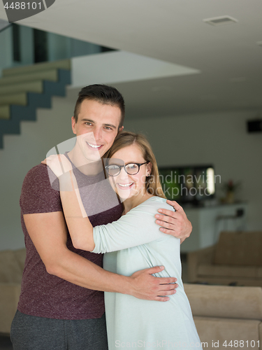 Image of couple hugging in their new home