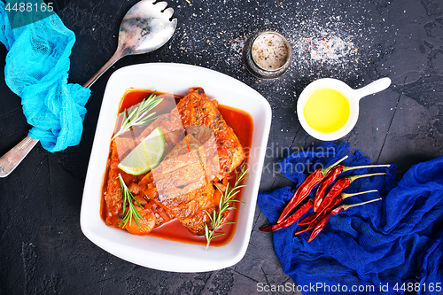 Image of fish with tomato sauce 