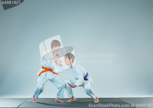 Image of The two boys fighting at Aikido training in martial arts school. Healthy lifestyle and sports concept