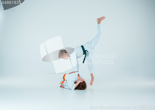 Image of The two boys fighting at Aikido training in martial arts school. Healthy lifestyle and sports concept