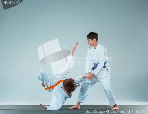 Image of The two boys fighting at Aikido training in martial arts school. Healthy lifestyle and sports concept