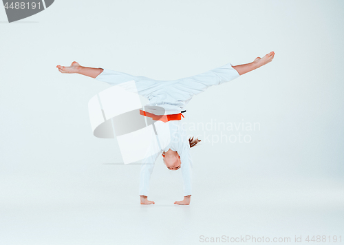 Image of The girl posing at Aikido training in martial arts school. Healthy lifestyle and sports concept