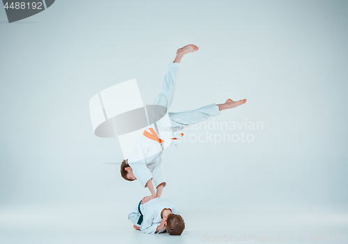 Image of The two boys fighting at Aikido training in martial arts school. Healthy lifestyle and sports concept