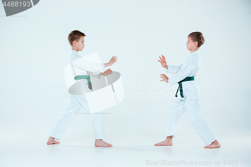 Image of The two boys fighting at Aikido training in martial arts school. Healthy lifestyle and sports concept