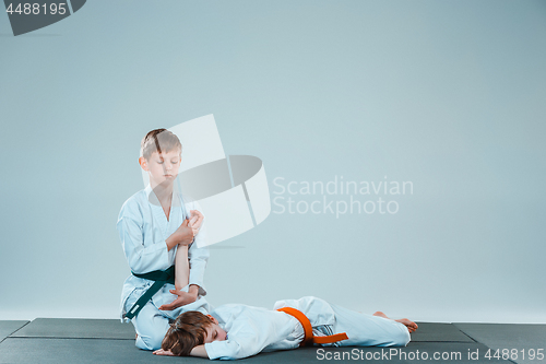 Image of The two boys fighting at Aikido training in martial arts school. Healthy lifestyle and sports concept