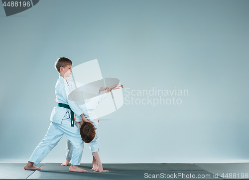 Image of The two boys fighting at Aikido training in martial arts school. Healthy lifestyle and sports concept