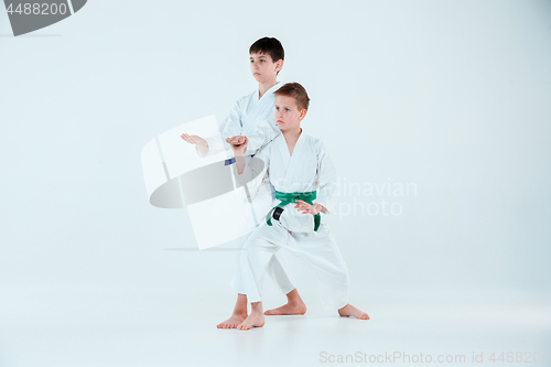 Image of The boys posing at Aikido training in martial arts school. Healthy lifestyle and sports concept