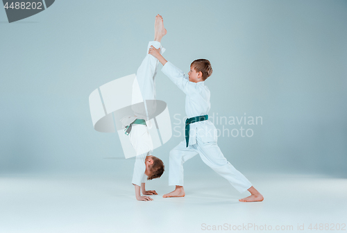 Image of The two boys fighting at Aikido training in martial arts school. Healthy lifestyle and sports concept