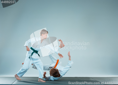 Image of The two boys fighting at Aikido training in martial arts school. Healthy lifestyle and sports concept