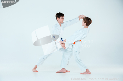 Image of The two boys fighting at Aikido training in martial arts school. Healthy lifestyle and sports concept