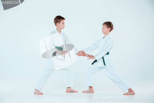 Image of The two boys fighting at Aikido training in martial arts school. Healthy lifestyle and sports concept