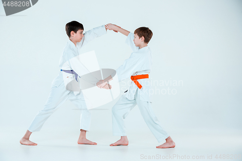 Image of The two boys fighting at Aikido training in martial arts school. Healthy lifestyle and sports concept