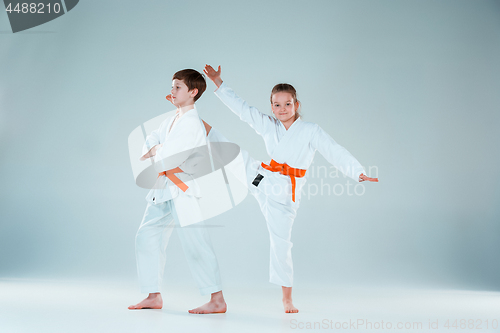 Image of The group of boys and girl at Aikido training in martial arts school. Healthy lifestyle and sports concept