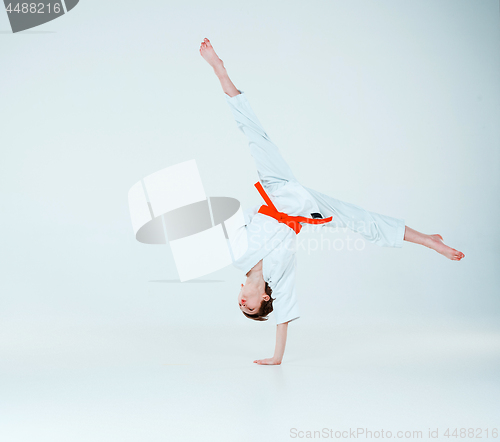 Image of The boy posing at Aikido training in martial arts school. Healthy lifestyle and sports concept