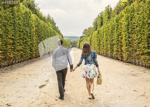 Image of Couple Walking in a Garden
