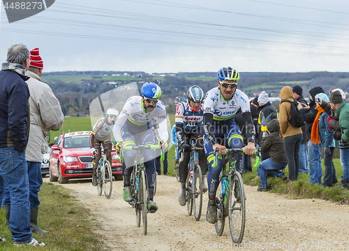 Image of The Peloton on a Dirty Road - Paris-Nice 2016