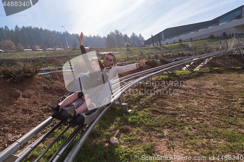 Image of couple enjoys driving on alpine coaster