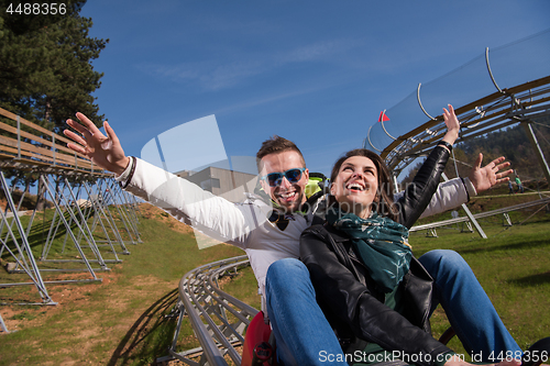 Image of couple enjoys driving on alpine coaster